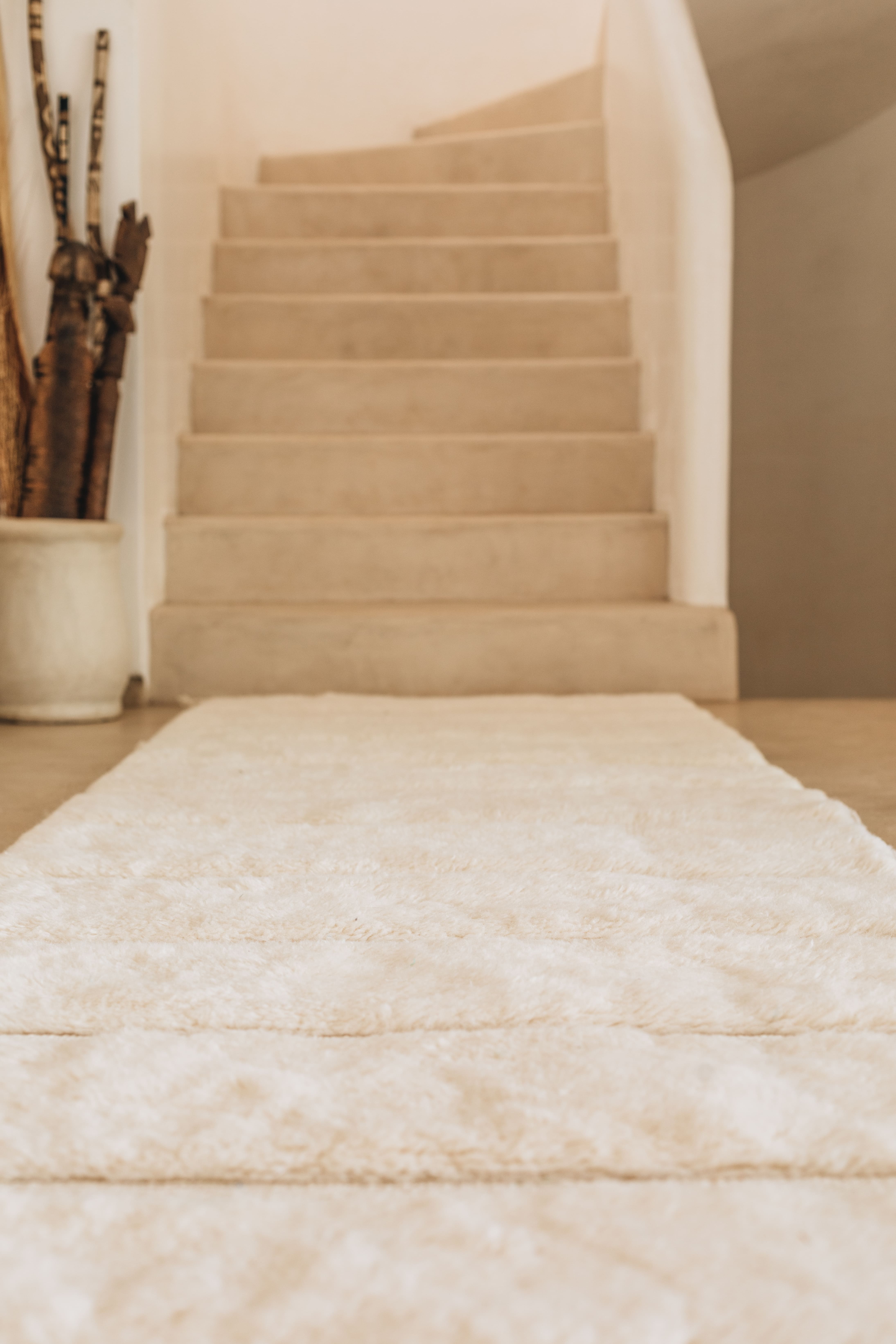 Berber carpet hallway white stairs